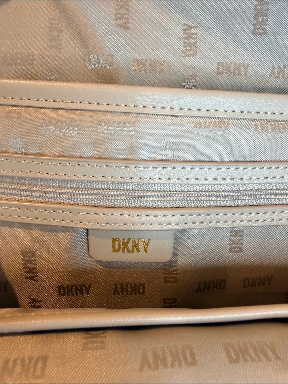 DKNY Monogram Logo Carlita Canvas Backpack in Beige Brown